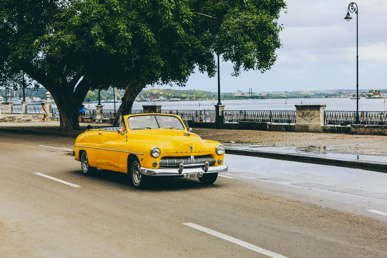 Yellow antique American convertible. Photo by Nick Karvounis.