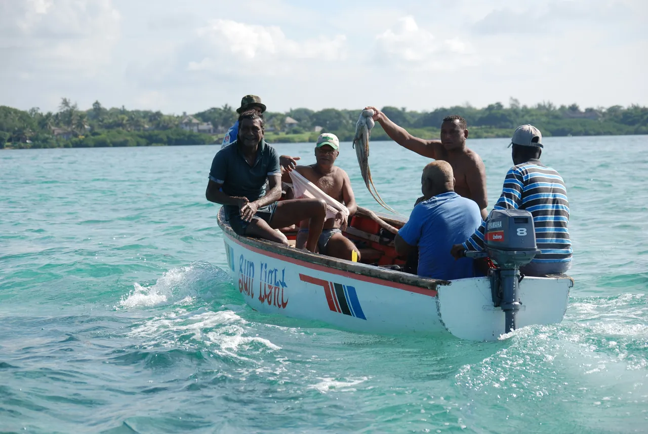 Fishermen in the sea. Photo by Easycab Mauritius.