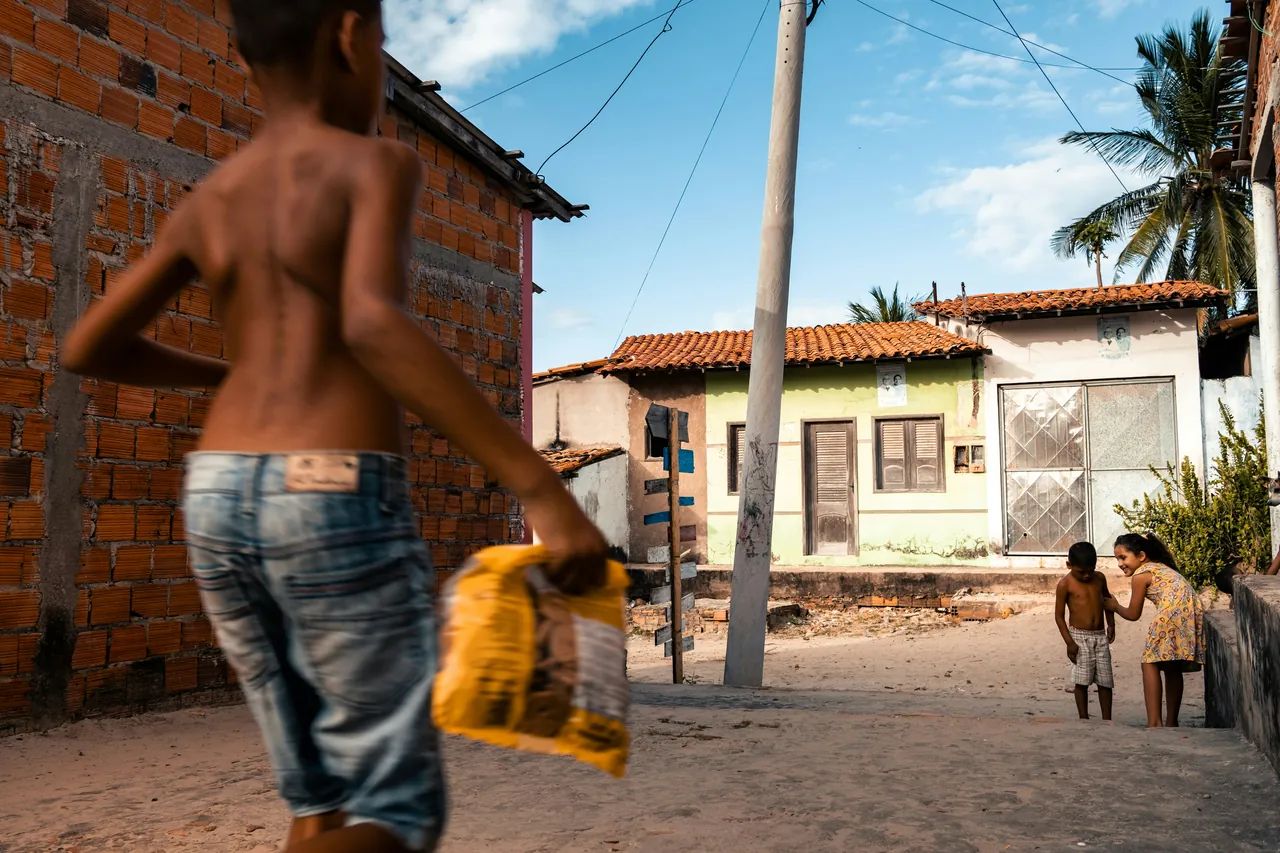 Child walking in country town street. Photo by Leo.
