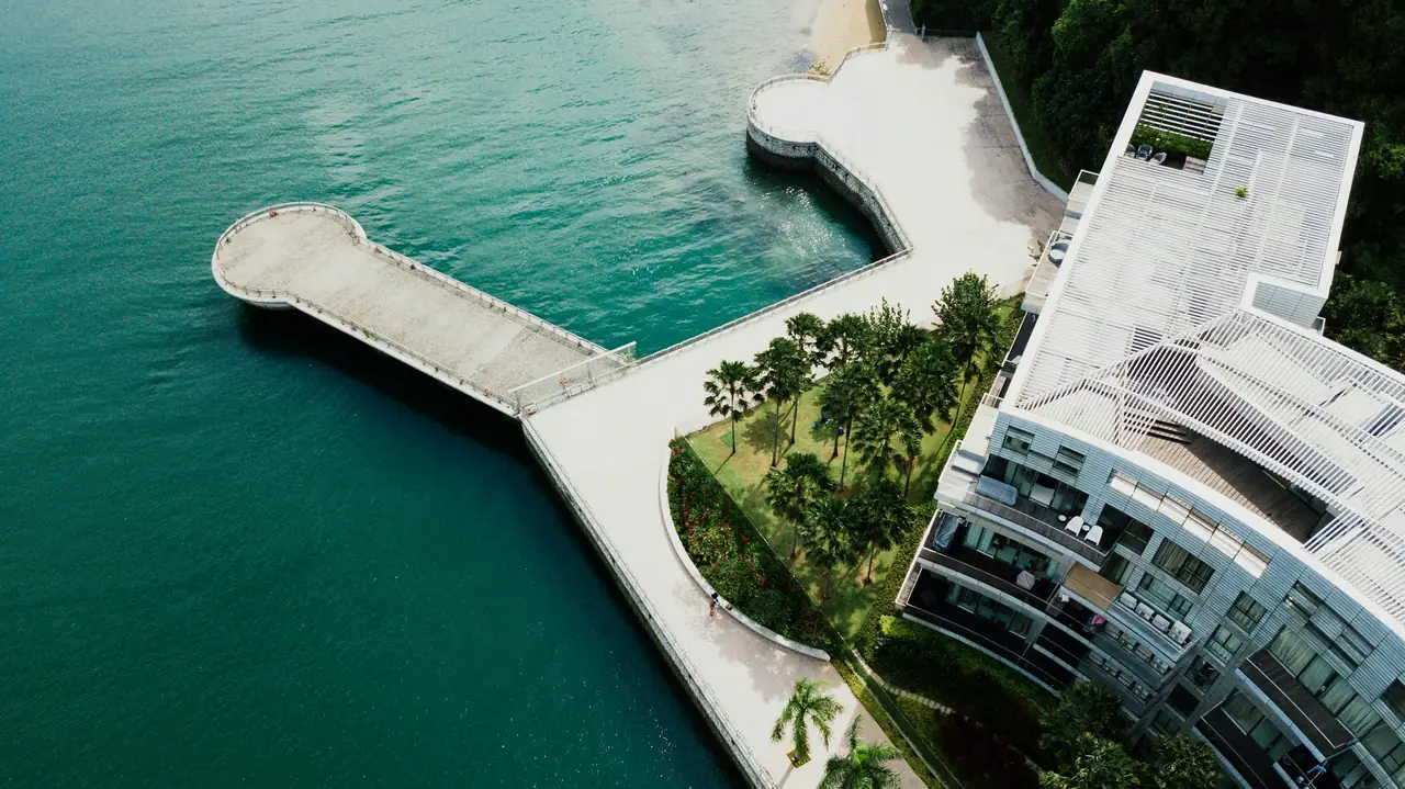 Aerial view of condo building by the ocean in Miami. Photo by Chuttersnap.