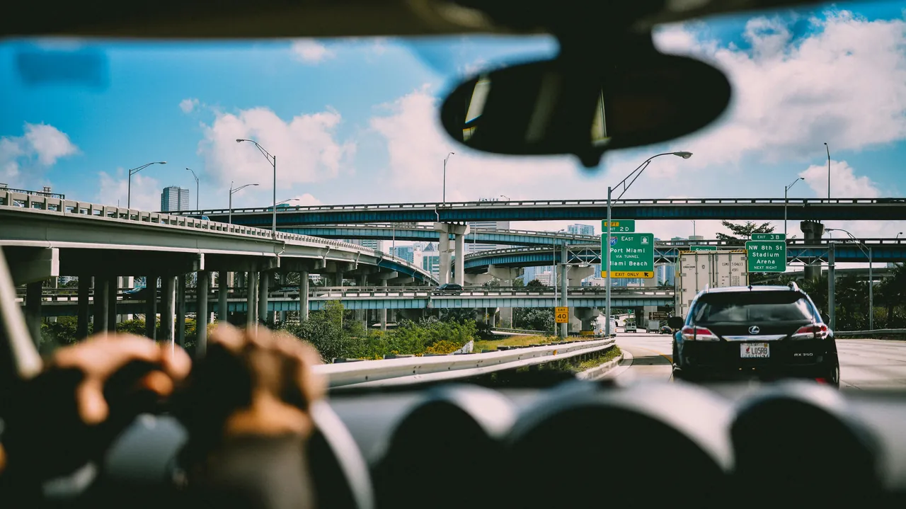 View of the highway from inside a car. Photo by Andras Vas.