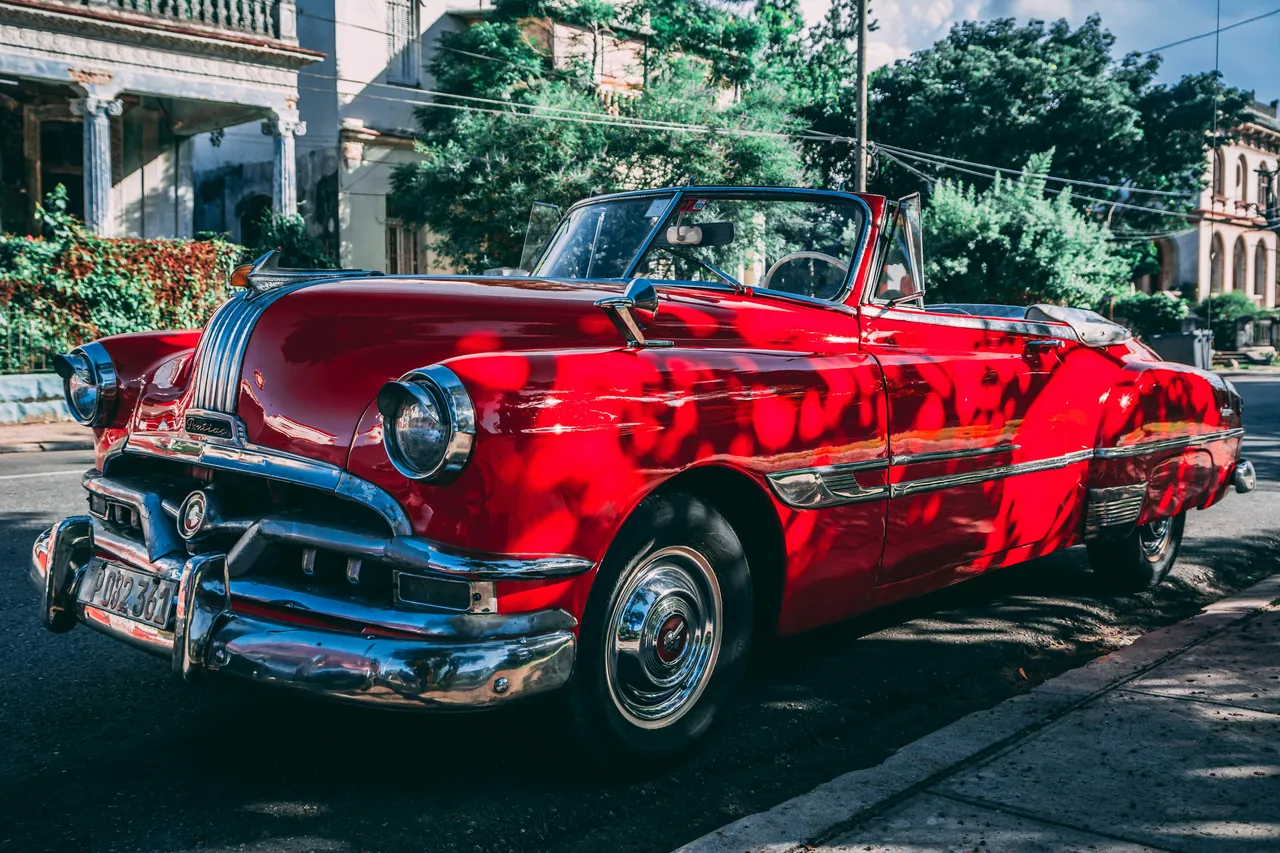 Red antique American car. Photo by Ivan Jevtic
